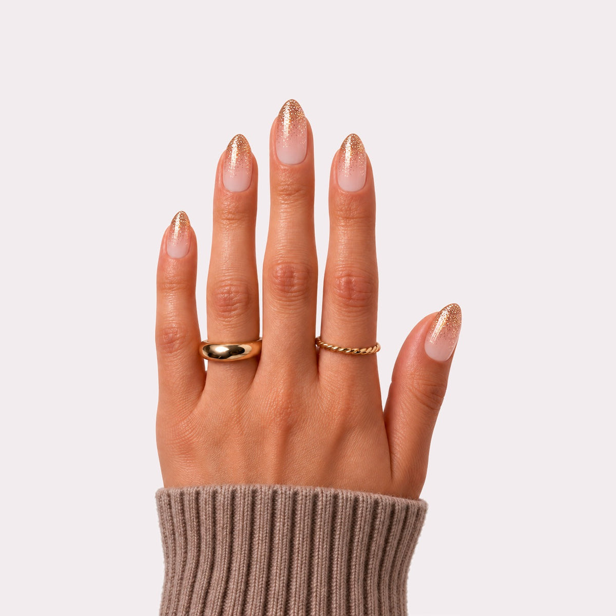 haute golden gossip press-on nails on hand