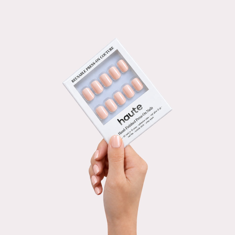 haute caught blushing press-on nails box in hand