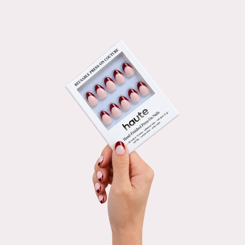 haute sip happens press-on nails box in hand