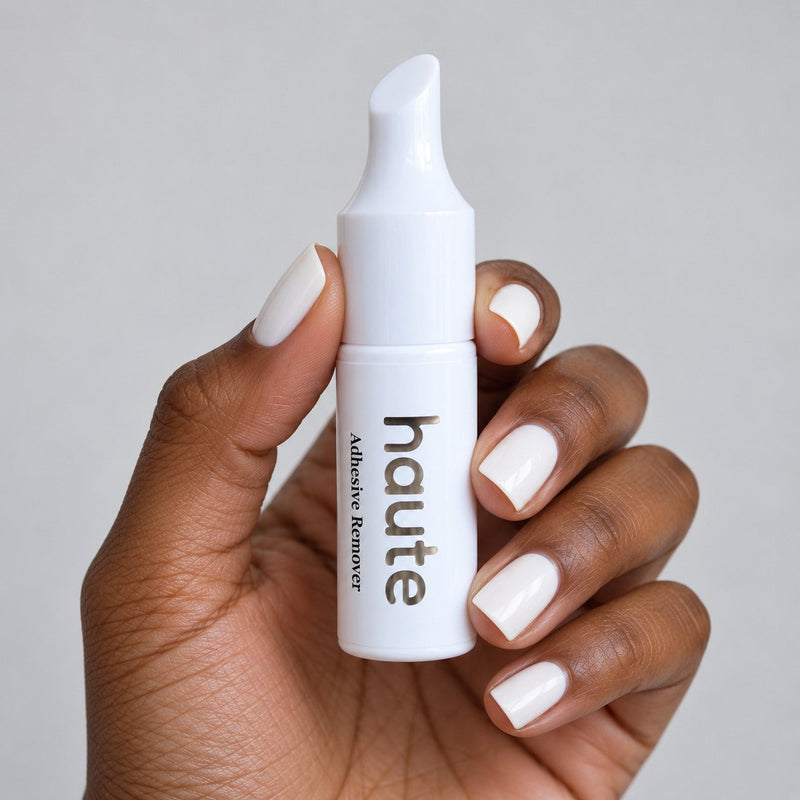 the reset nail glue remover bottle held in hand