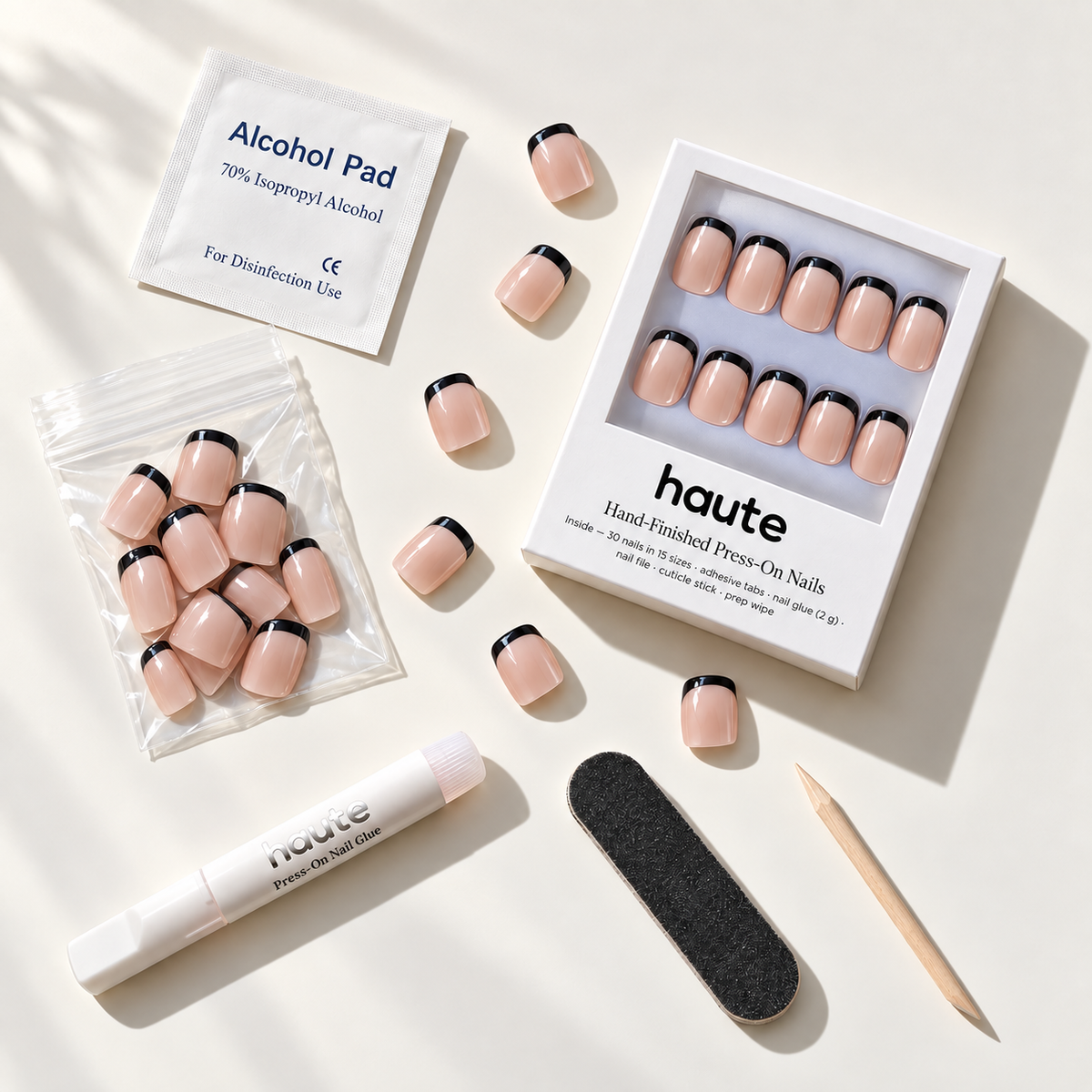 haute press-on nail kit with nail glue and adhesive tabs