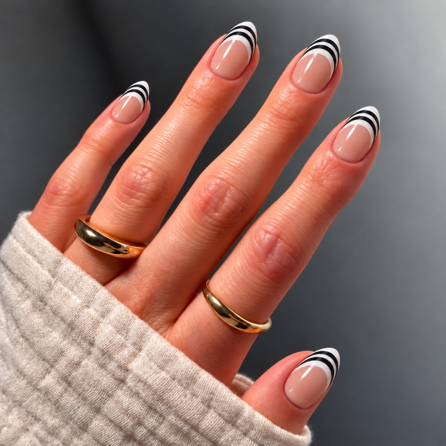 short almond double take striped French press-on nails on hand