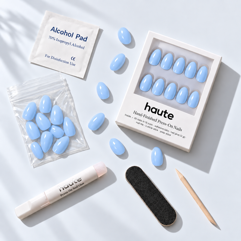 what's in the cloud nine-ish box: 30 nails in 15 sizes, nail glue, adhesive tabs, file, cuticle stick and prep wipe