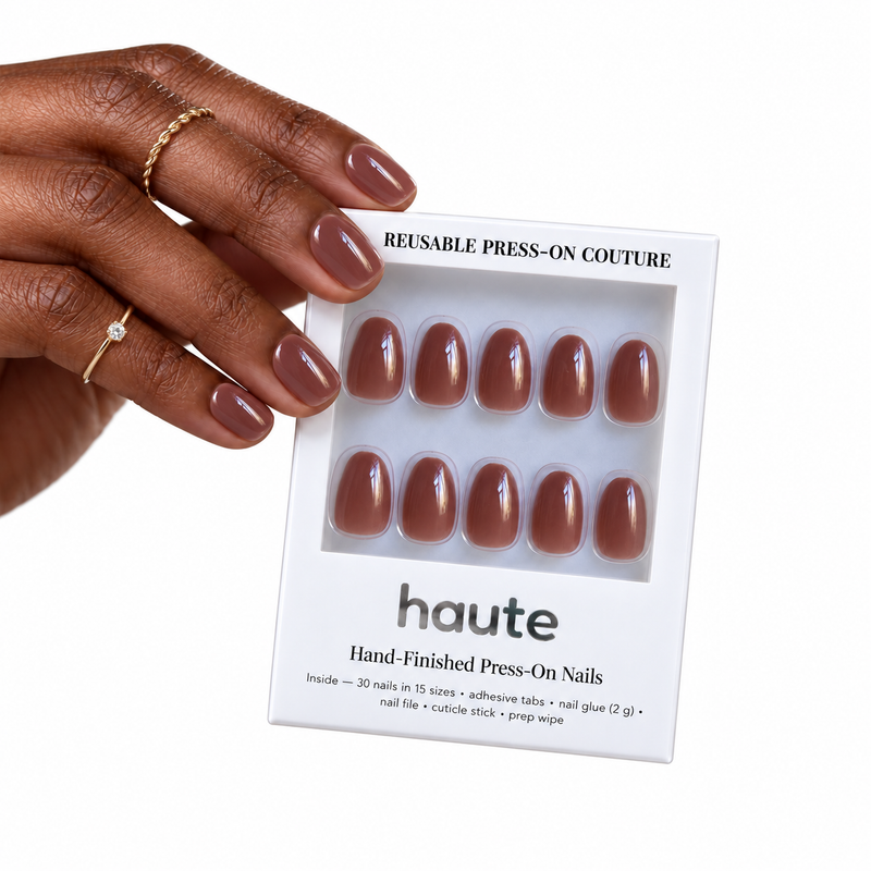 espresso edit short oval mocha brown press-on nails worn while holding the haute box
