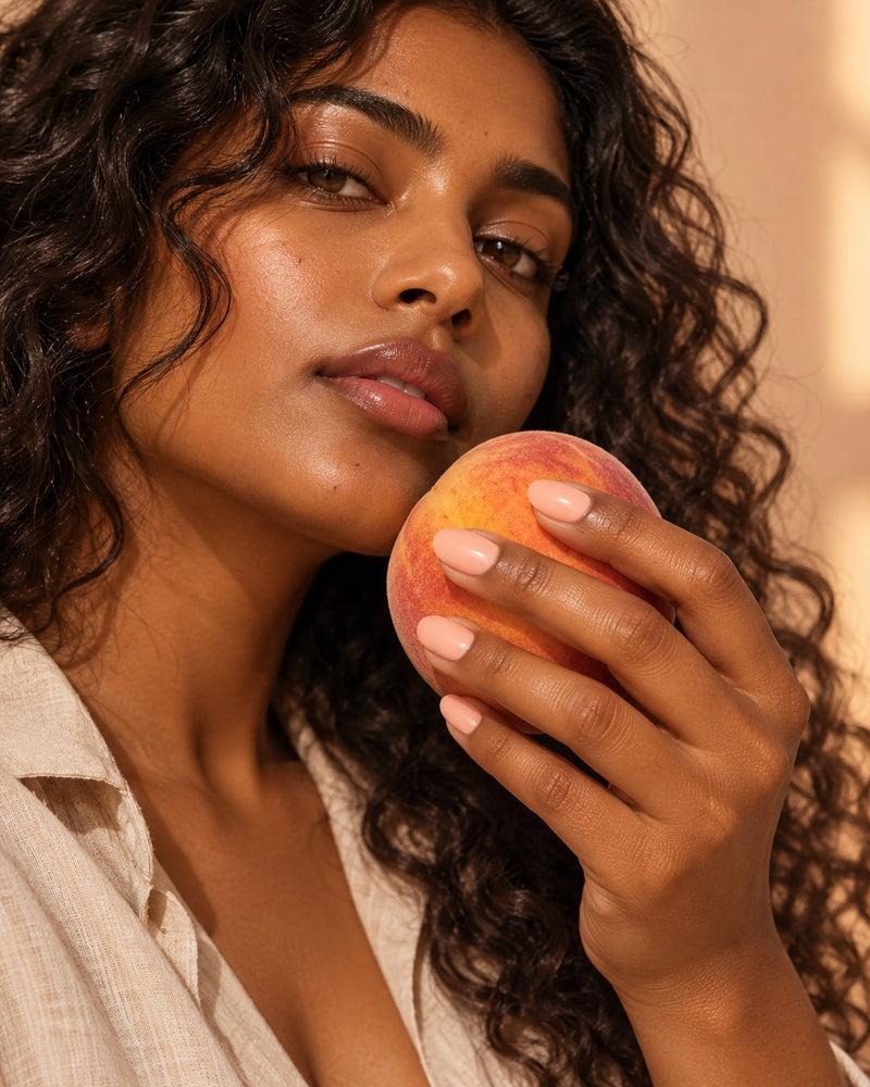 Model wearing haute peach affair press-on nails