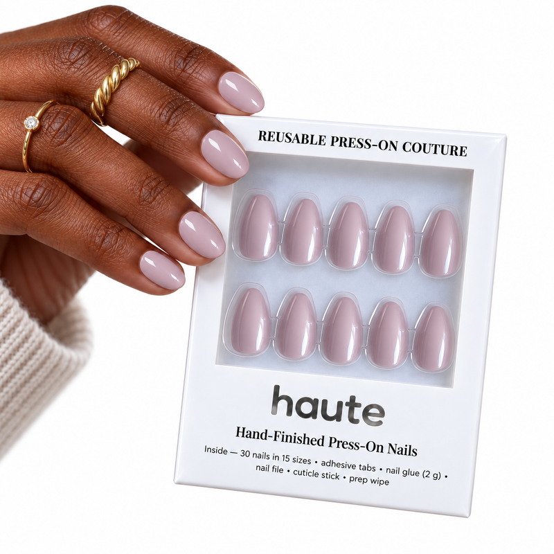lilac crush short almond soft lavender press-on nails worn while holding the haute box
