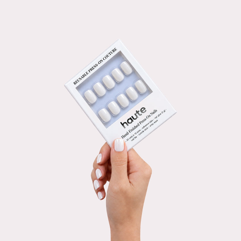 haute milk money press-on nails box in hand